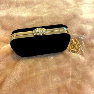 Black suede clutch.